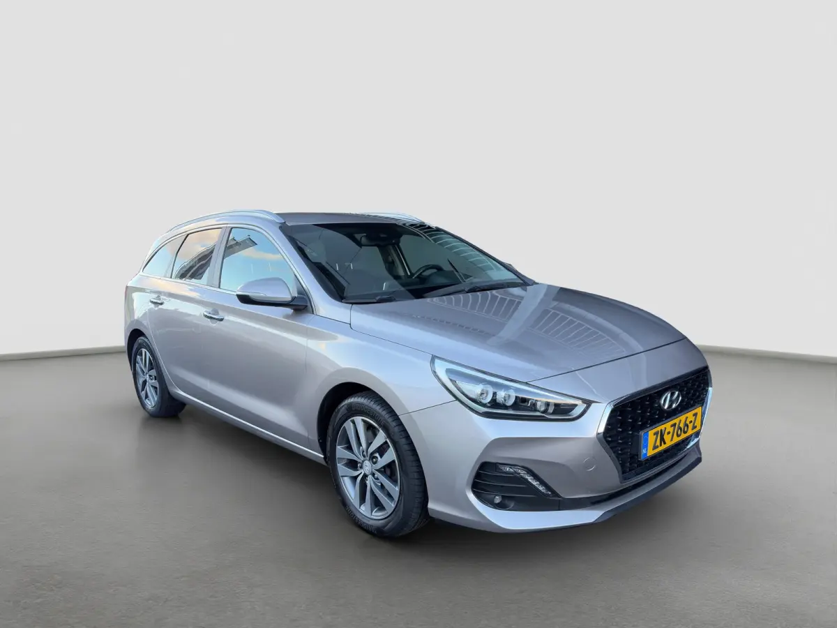 1.4 T-GDI 140pk Premium | Camera | Trekhaak | Climate controle | Carplay | Cruise controle | Half leder | Navigatie | Parkeersensoren
