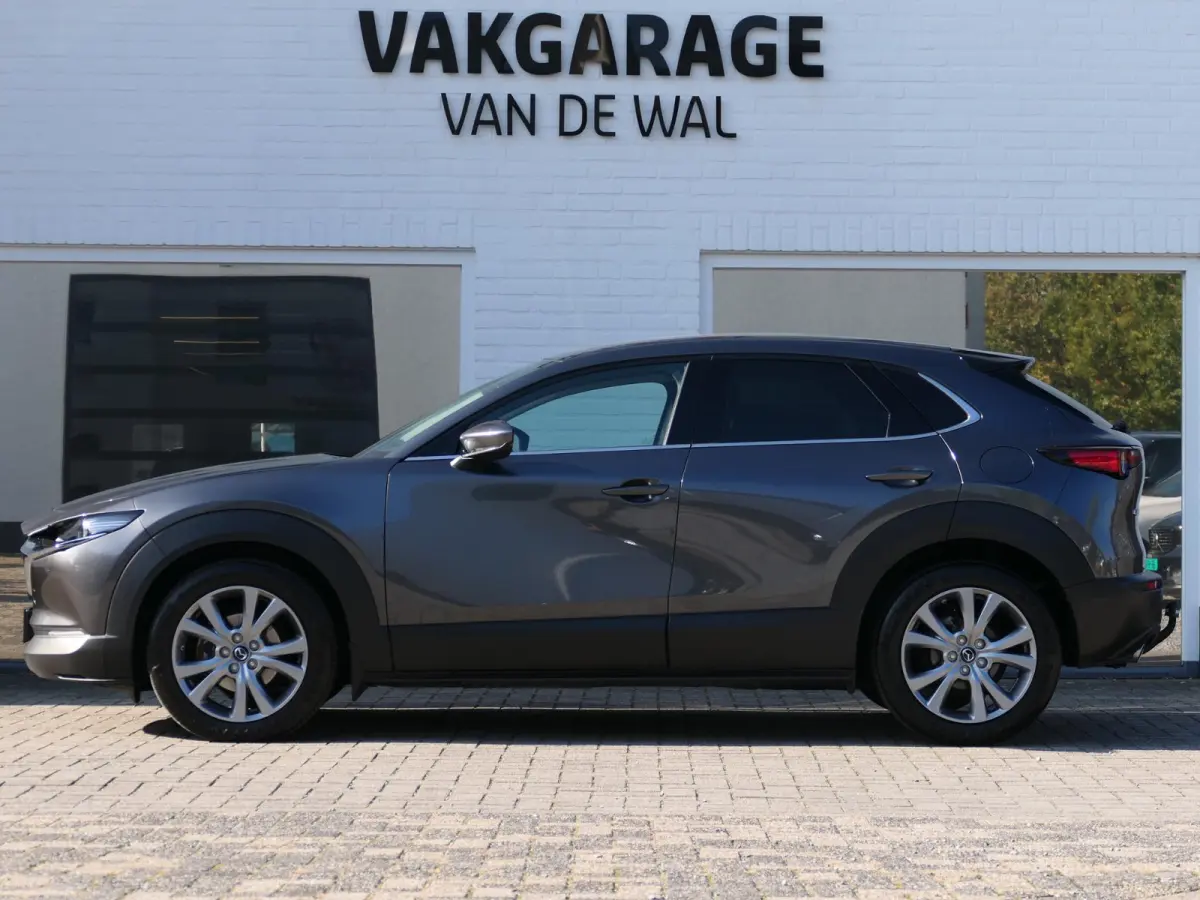 2.0 e-SkyActiv-G M Hybrid Exclusive-line | Trekhaak | Head-up display | Leder | Memory | Elektrische achterklep | Apple-/Android Carplay | Dodehoek detectie | Stuur-/Stoelverwarming | Achter