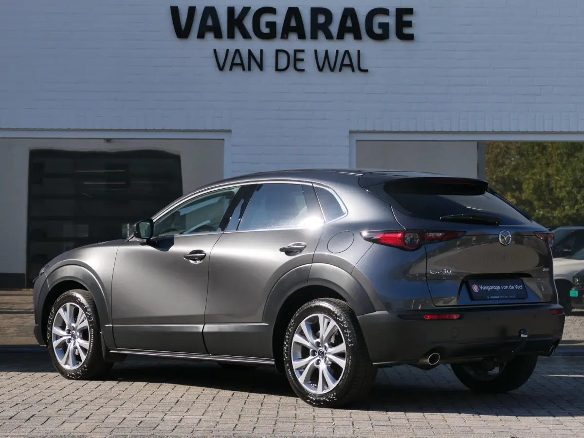 2.0 e-SkyActiv-G M Hybrid Exclusive-line | Trekhaak | Head-up display | Leder | Memory | Elektrische achterklep | Apple-/Android Carplay | Dodehoek detectie | Stuur-/Stoelverwarming | Achter