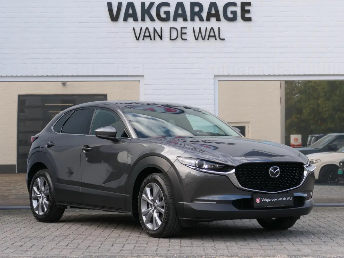 2.0 e-SkyActiv-G M Hybrid Exclusive-line | Trekhaak | Head-up display | Leder | Memory | Elektrische achterklep | Apple-/Android Carplay | Dodehoek detectie | Stuur-/Stoelverwarming | Achter