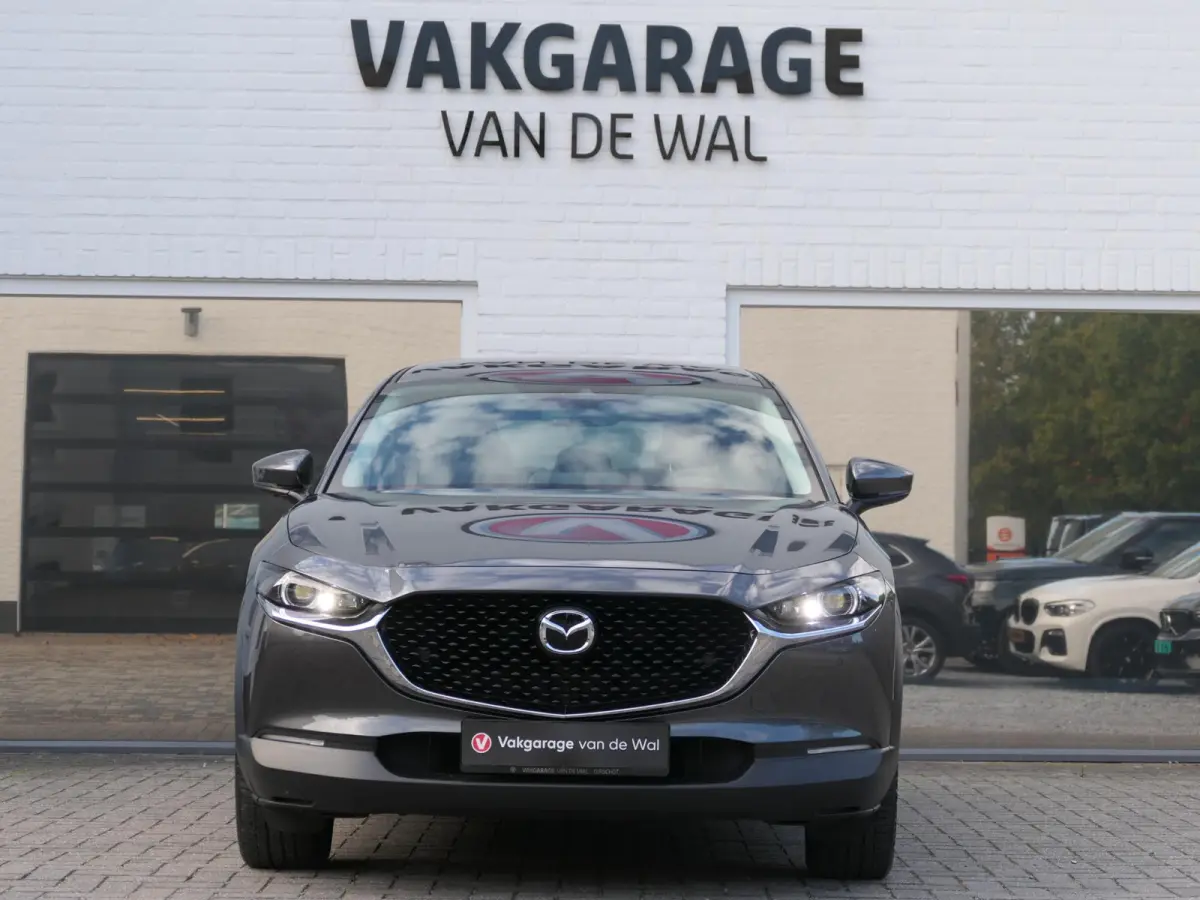 2.0 e-SkyActiv-G M Hybrid Exclusive-line | Trekhaak | Head-up display | Leder | Memory | Elektrische achterklep | Apple-/Android Carplay | Dodehoek detectie | Stuur-/Stoelverwarming | Achter