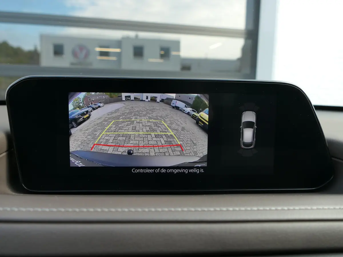 2.0 e-SkyActiv-G M Hybrid Exclusive-line | Trekhaak | Head-up display | Leder | Memory | Elektrische achterklep | Apple-/Android Carplay | Dodehoek detectie | Stuur-/Stoelverwarming | Achter
