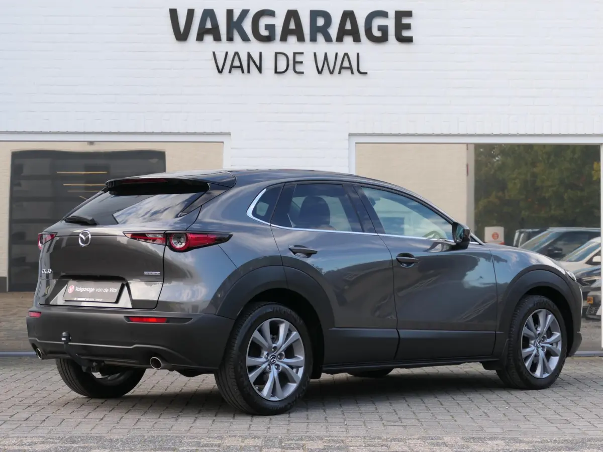 2.0 e-SkyActiv-G M Hybrid Exclusive-line | Trekhaak | Head-up display | Leder | Memory | Elektrische achterklep | Apple-/Android Carplay | Dodehoek detectie | Stuur-/Stoelverwarming | Achter