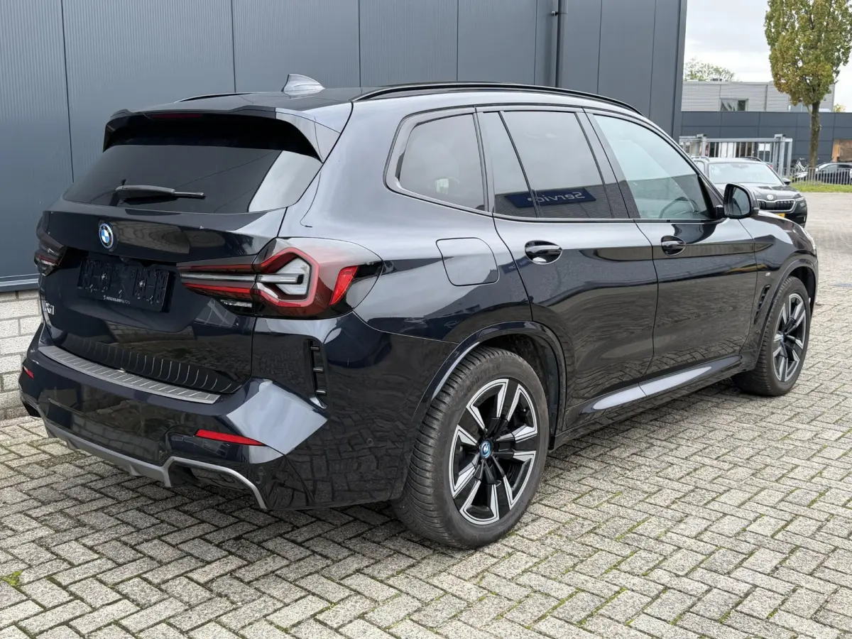 Executive M Sport 80 kWh 19"/SOH 99,9%/Panoramadak/Leder + memory/Stoelverwarming/Dodehoek/Elektrische klep/Camera/Adaptieve cruise/Apple Carplay & Android Auto