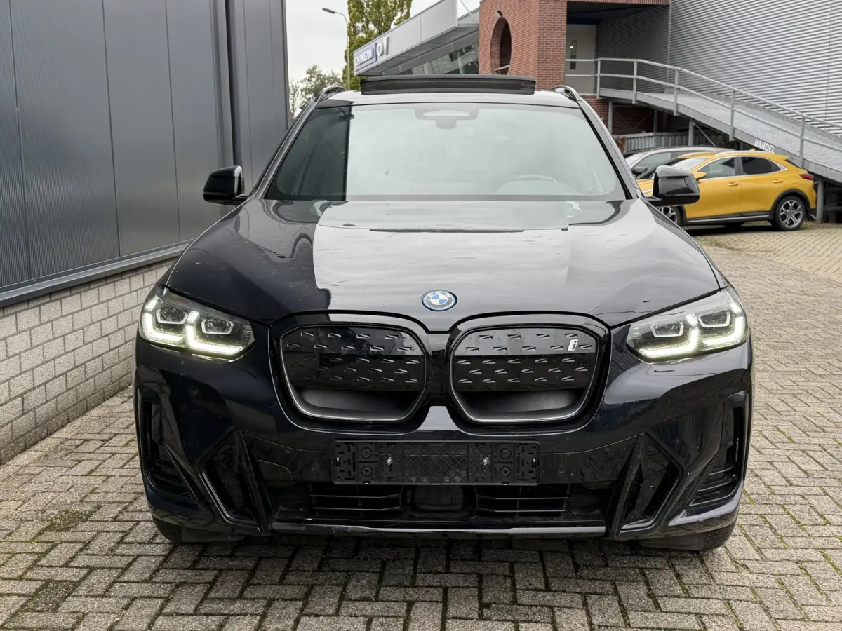 Executive M Sport 80 kWh 19"/SOH 99,9%/Panoramadak/Leder + memory/Stoelverwarming/Dodehoek/Elektrische klep/Camera/Adaptieve cruise/Apple Carplay & Android Auto