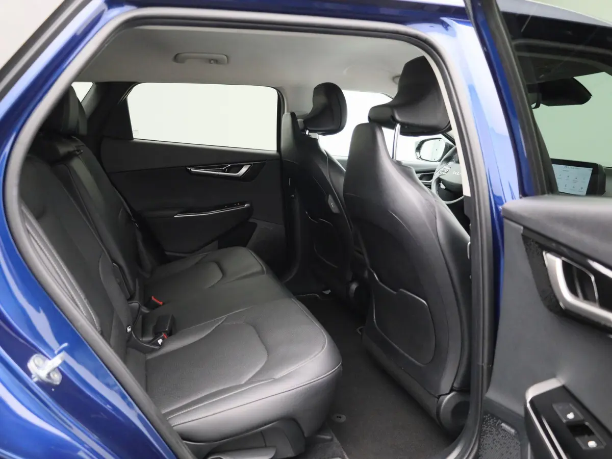 Plus 77.4 kWh | 100% SOH | Voorstoelen Verwarmd/Gekoeld | Trekhaak | Achterbank Verwarmd | Warmtepomp | Adaptieve Cruise Control | Sfeerverlichting | Apple Carplay/Android Auto | Kunstledere